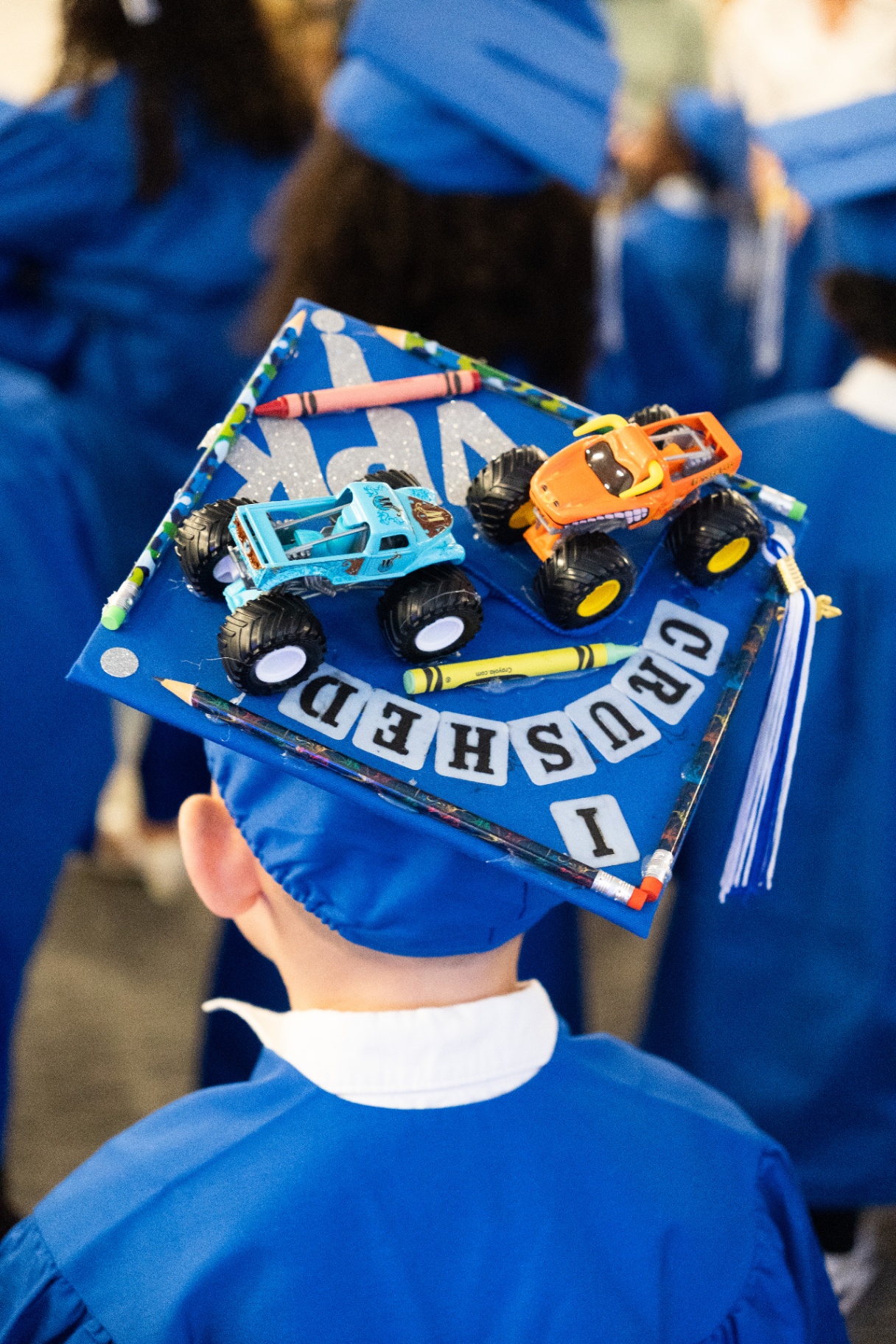 Decorated VPK graduation cap with monster trucks