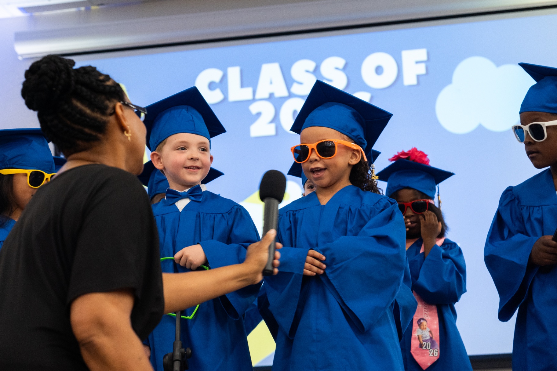 VPK graduate speaking into the microphone