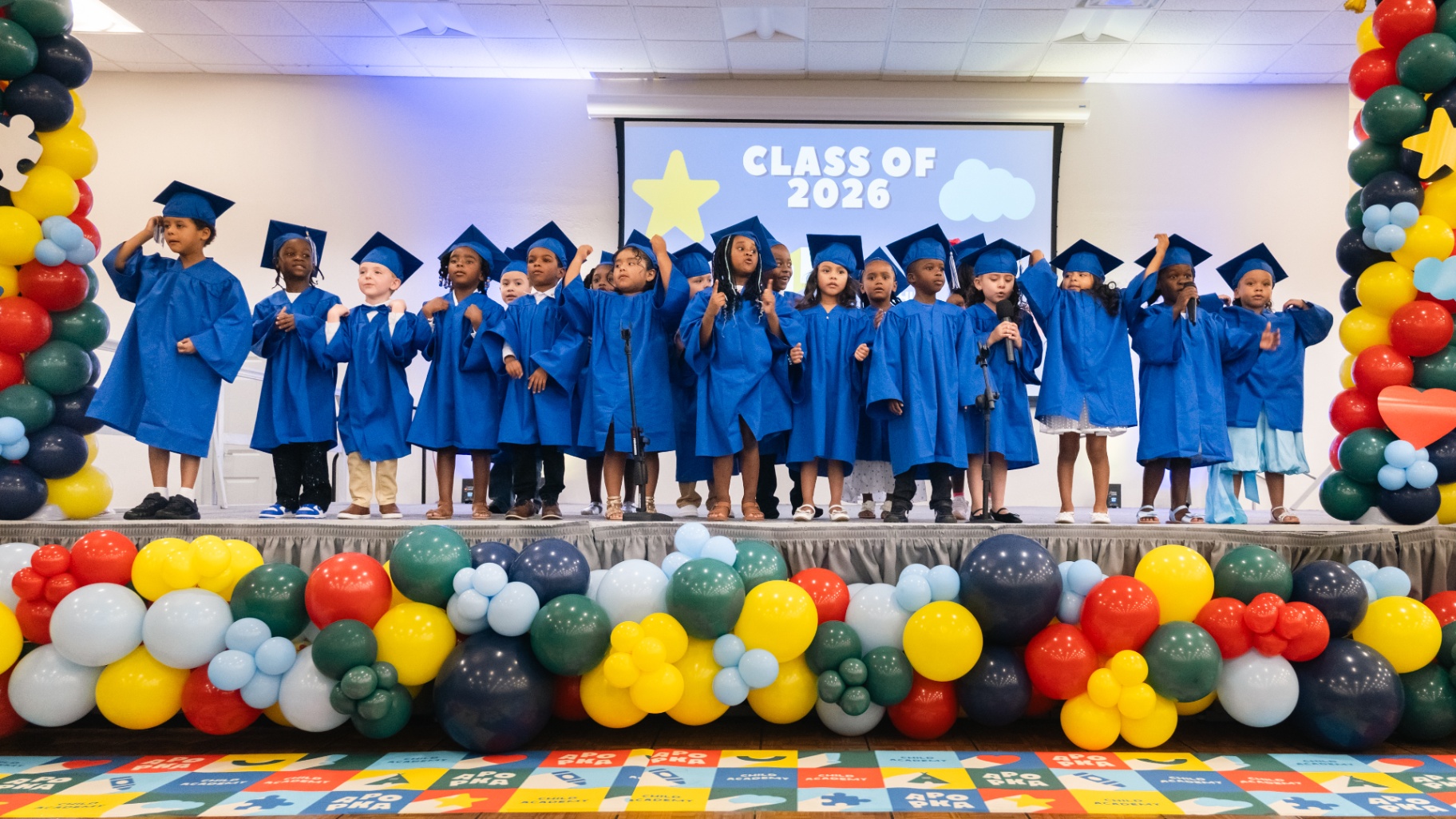 VPK Class of 2026 singing on stage at graduation